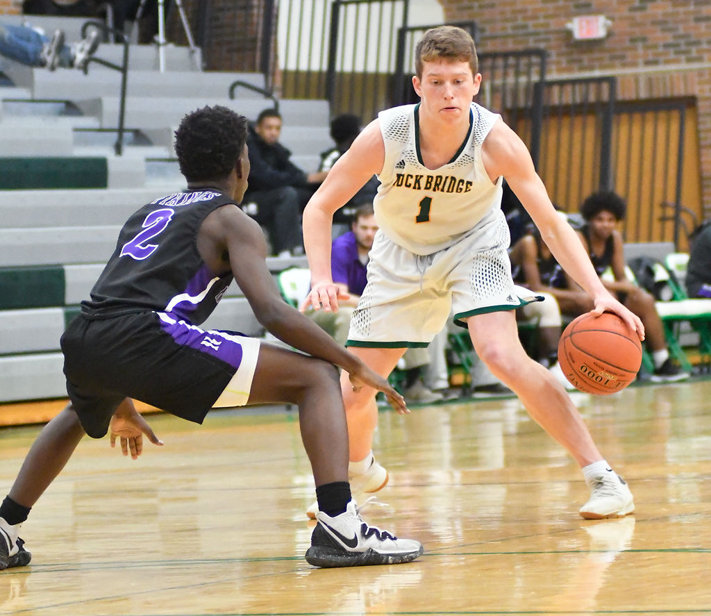 Rock Bridge's Hudson Dercher maneuvers around the Northeast Vikings